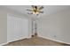 Clean bedroom features closet, new fan, and modern flooring at 1533 Loch Avich Rd, Winter Garden, FL 34787