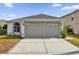 One-story home with attached garage and landscaped yard at 1533 Loch Avich Rd, Winter Garden, FL 34787