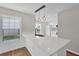 Bright kitchen features a large center island, modern pendant lighting, and new stainless sink at 1533 Loch Avich Rd, Winter Garden, FL 34787