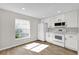 Efficient kitchen features modern white appliances and ample natural light at 1533 Loch Avich Rd, Winter Garden, FL 34787