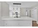 Bright kitchen featuring an island with quartz countertop, modern pendant lights, and stainless appliances at 1533 Loch Avich Rd, Winter Garden, FL 34787