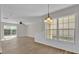 Open-concept living room and dining area featuring hardwood floors and a large window at 1533 Loch Avich Rd, Winter Garden, FL 34787