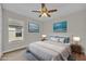 Staged main bedroom featuring modern decor, large bed, and natural light at 1533 Loch Avich Rd, Winter Garden, FL 34787