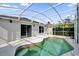 Screened-in pool area with clean water, privacy landscaping, and a white painted screened enclosure at 1533 Loch Avich Rd, Winter Garden, FL 34787