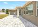 Covered patio showcasing a tiled area, ceiling fans and stylish design of the home's exterior at 2781 Sand Oak Loop, Apopka, FL 32712