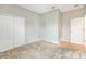 This bedroom features a double door closet and neutral carpet at 2781 Sand Oak Loop, Apopka, FL 32712