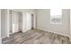 Bedroom featuring wood-style flooring and closet space with additional storage at 2781 Sand Oak Loop, Apopka, FL 32712