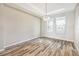 Bright dining room highlighting modern flooring, recessed lighting, and large windows at 2781 Sand Oak Loop, Apopka, FL 32712