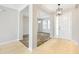 Open foyer featuring tile flooring, modern lighting, and an open view to the dining room at 2781 Sand Oak Loop, Apopka, FL 32712