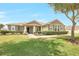 Charming single-story home featuring a well-manicured lawn and inviting front porch at 2781 Sand Oak Loop, Apopka, FL 32712