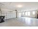 This garage features large windows, block walls and concrete flooring at 2781 Sand Oak Loop, Apopka, FL 32712