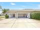 Spacious three-car garage with automatic doors and ample driveway parking at 2781 Sand Oak Loop, Apopka, FL 32712