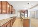 Well-equipped kitchen has granite counters, stainless appliances, spacious island and tile floors at 2781 Sand Oak Loop, Apopka, FL 32712