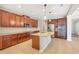 Gourmet kitchen features stainless appliances, double ovens, granite counters and tile floors at 2781 Sand Oak Loop, Apopka, FL 32712
