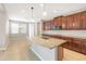 Modern kitchen boasts granite counters, stainless steel appliances and a spacious center island at 2781 Sand Oak Loop, Apopka, FL 32712