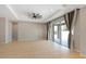 Bright and airy living room features tile flooring, recessed lighting, and glass doors to the outdoor area at 2781 Sand Oak Loop, Apopka, FL 32712