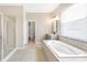 The main bathroom boasts soaking tub, separate shower, and double sink vanity at 2781 Sand Oak Loop, Apopka, FL 32712