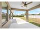 Covered patio with ceiling fan and beautiful backyard views at 2781 Sand Oak Loop, Apopka, FL 32712