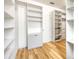 Well-organized walk-in closet with custom shelving and built-in storage solutions at 2781 Sand Oak Loop, Apopka, FL 32712