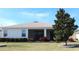Beautiful backyard showcasing a screened-in porch area and a well-manicured lawn with mature landscaping at 3621 Arlington Ridge Blvd, Leesburg, FL 34748