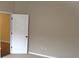 Neutral bedroom with a white door, carpet, and light-colored walls at 3621 Arlington Ridge Blvd, Leesburg, FL 34748