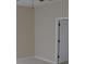 Empty bedroom with neutral colored walls, carpet, and an interior door at 3621 Arlington Ridge Blvd, Leesburg, FL 34748