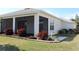 Exterior view of a home with a screened-in patio and landscaped yard at 3621 Arlington Ridge Blvd, Leesburg, FL 34748