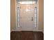 Elegant front door featuring decorative glass side panels and a transom window at 3621 Arlington Ridge Blvd, Leesburg, FL 34748