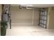 Bright garage features a water heater, garage door opener, and epoxy flooring at 3621 Arlington Ridge Blvd, Leesburg, FL 34748