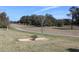 Well-maintained golf course view with manicured lawns and mature trees at 3621 Arlington Ridge Blvd, Leesburg, FL 34748