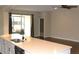 Spacious countertops overlooking the living area and an adjacent outdoor patio at 3621 Arlington Ridge Blvd, Leesburg, FL 34748