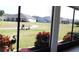 Screened-in patio with a view of the backyard and surrounding neighborhood at 3621 Arlington Ridge Blvd, Leesburg, FL 34748