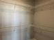 A spacious walk-in closet with wire shelving for organization and storage at 1342 Twelve Oaks Rd, Saint Cloud, FL 34771