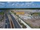 Aerial view of homes under construction, showcasing various stages of development at 1366 Twelve Oaks Rd, Saint Cloud, FL 34771