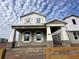 Two-story Craftsman home with stone accents and a front porch at 1366 Twelve Oaks Rd, Saint Cloud, FL 34771