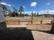 Unfinished front yard with a wooden fence providing a clear view of the surrounding environment at 1366 Twelve Oaks Rd, Saint Cloud, FL 34771