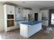 Modern kitchen featuring white shaker cabinets and an island at 1366 Twelve Oaks Rd, Saint Cloud, FL 34771