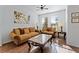 Elegant living room with hardwood floors, comfortable sofas, and large windows for natural light at 2601 Isla Vista Ct, Kissimmee, FL 34747