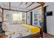 Bedroom featuring a canopy bed with backyard views at 2601 Isla Vista Ct, Kissimmee, FL 34747