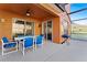 Covered patio with an outdoor dining set and a grill at 2601 Isla Vista Ct, Kissimmee, FL 34747