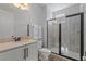 Bathroom featuring a modern vanity and glass-enclosed shower providing a sleek and functional design at 7647 Fairfax Dr, Kissimmee, FL 34747