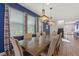 Elegant dining room featuring modern chandeliers and large table at 7647 Fairfax Dr, Kissimmee, FL 34747