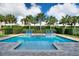 Backyard pool with a spa, paved patio and tropical trees at 7647 Fairfax Dr, Kissimmee, FL 34747