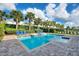 Relaxing backyard pool area with lounge chairs, greenery, and blue skies at 7647 Fairfax Dr, Kissimmee, FL 34747