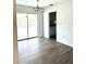 Dining area with wood-look floors and sliding glass doors at 1347 W Wellington Dr, Deltona, FL 32725