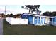 Cute blue house with white fence and small yard at 1347 W Wellington Dr, Deltona, FL 32725