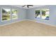 Bright bedroom with tile floors and multiple windows at 3290 Cross Fox Dr, Mulberry, FL 33860