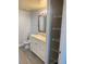 This bathroom features a granite vanity countertop, storage and a decorative towel rack at 3468 Soho St # 107, Orlando, FL 32835