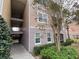 Apartment exterior view with walkway and well-maintained landscaping at 3468 Soho St # 107, Orlando, FL 32835