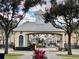 Community entrance gate with a clock tower and nicely landscaped entrance at 3468 Soho St # 107, Orlando, FL 32835